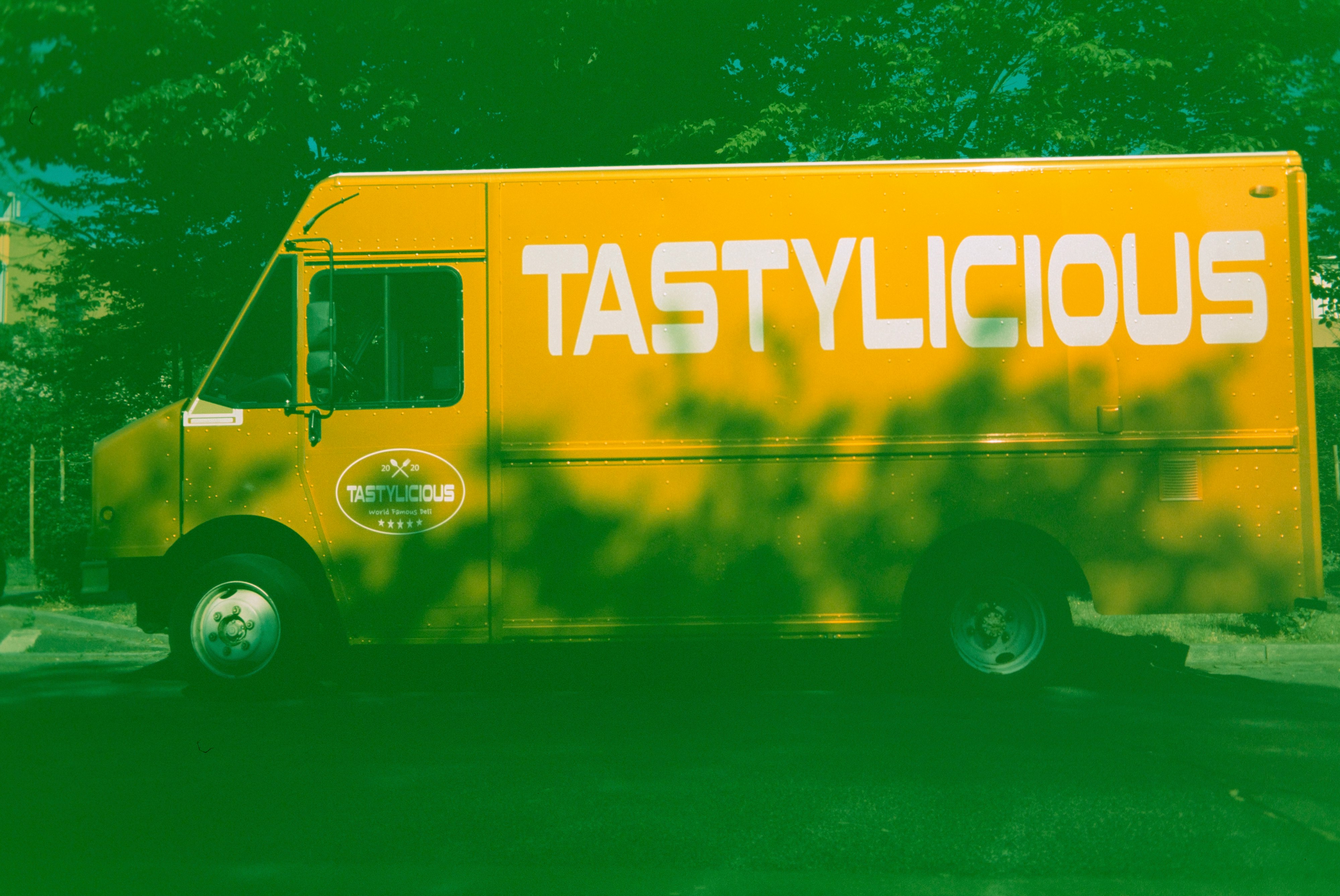 yellow and black van on road during daytime